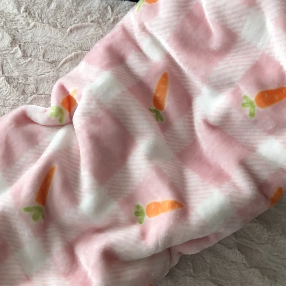 HOPPY SPRING Plush Throw Blanket - Pink & White with a Carrot Design